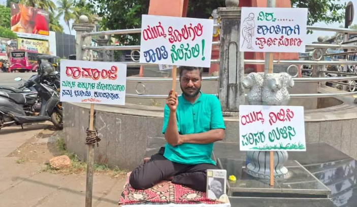 Lecturer holds solo sit-in for world peace