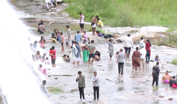 Girls Place Feet on Ganga Idol at Srinivasa Sagar Reservoir
