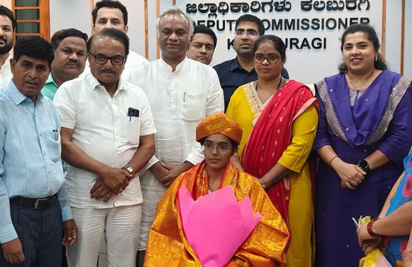 II PUC topper Srishti felicitated by Minister Priyank Kharge