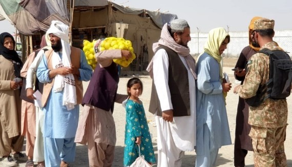 Afghan migrants detained in late-night police raids