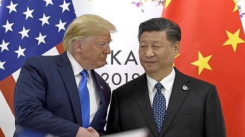 China blasts US over 100% tariff threat