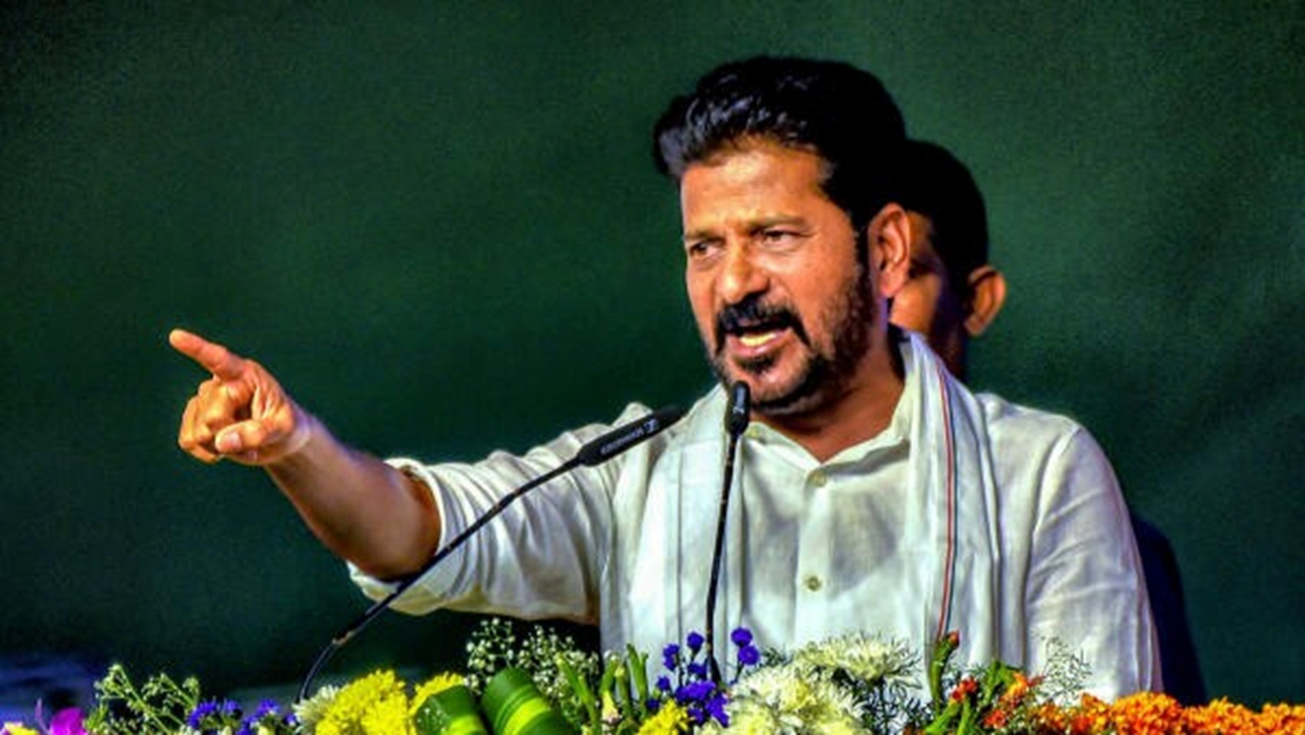 Revanth Reddy slams BRS-BJP bond, stalling devpts in State