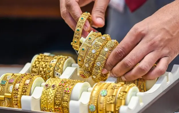 Gold, Silver fall as dollar gains strength