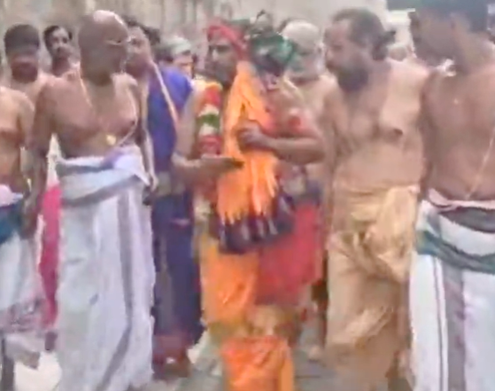 Welcomed with grand palanquin procession, offers blessings to devotees