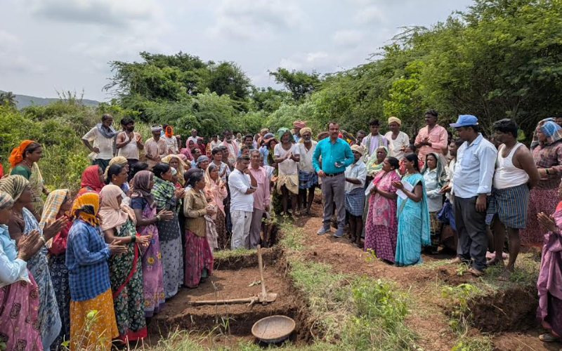 Village workers receive guidance during official inspection