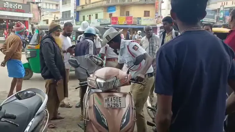 Kolar police enforce compulsory helmet rule